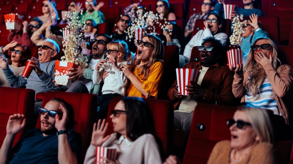 A Group of People are in the Movie Theater Watching a 3D Movie